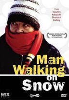 THE MAN WALKING ON THE SNOW